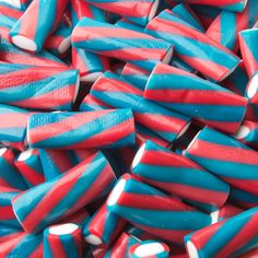 red, white and blue candy canes are stacked together