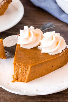 a slice of pumpkin pie with whipped cream on top