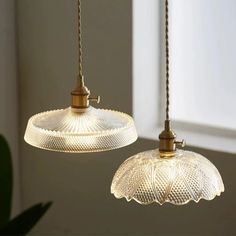 two lights hanging from a ceiling in a room