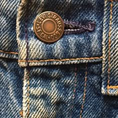 a button on the back of a pair of jeans