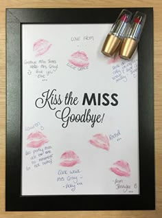 two lipsticks are on top of a paper with the words kiss the miss goodbye