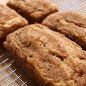 some food that is sitting on a wire rack with the words, snickkeddoodle bread