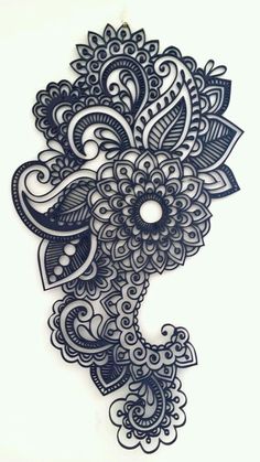 an intricately designed piece of paper with black and white designs on it's side