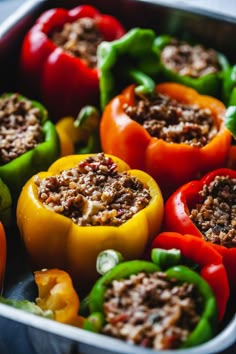 the peppers are stuffed with ground meat and ready to be cooked in the oven for dinner