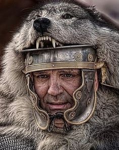 a man in armor with an animal's head on his face