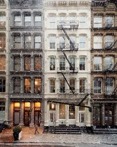 an image of a building in the snow with fire escapes on it's side