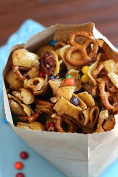 a paper bag filled with cereal on top of a blue plate