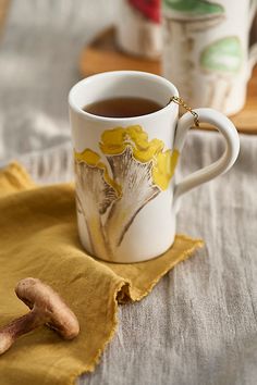 a cup of tea on a yellow napkin