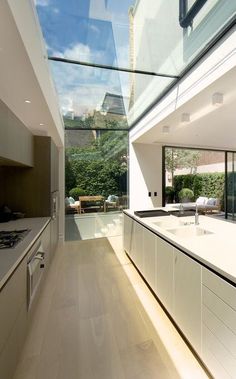 the kitchen is very large and has an open floor plan with skylights above it