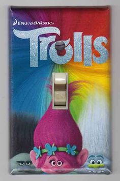 the trolly light switch cover is pink and has blue flowers on it's head