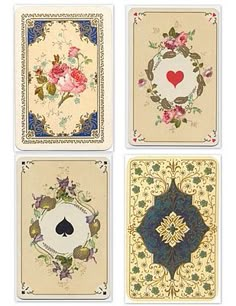 four playing cards with flowers and hearts on the front, one in blue, one in red