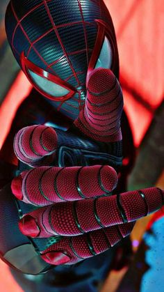 a close up of a spider man glove