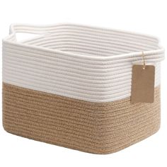 a white and brown basket with a tag on it