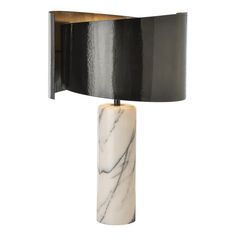 a black and white lamp with a marble base