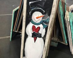 a snowman painted on the side of a building