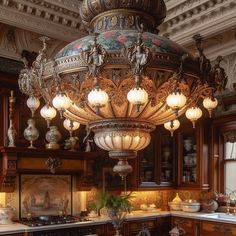 an ornate chandelier hangs from the ceiling in a kitchen