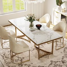 a marble dining table surrounded by white chairs