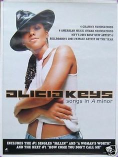 an advertisement for the album called alien keys, featuring a woman in a cowboy hat with her arms crossed