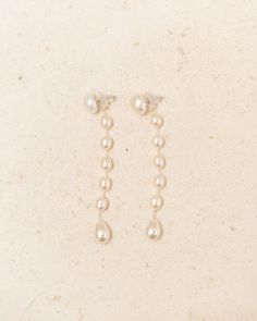 Medium Passante earrings by Sophie Buhai in pearl. Dainty drop earrings featuring the staggered suspension of elemental freshwater pearls in their natural, polished beauty. Fastened with a post backing at a crystal pearl stud. Freshwater Pearl, Crystal Pearl.Handcrafted in Los Angeles. Christian Wijnants, Sophie Buhai, Unisex Dress, Pearl Crystal, Wallet Accessories, Gift Card Sale, Crystal Pearls, Pearl Studs, Pearl Drop Earrings