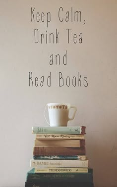 a stack of books with a coffee cup on top and the words keep calm, drink tea and read books