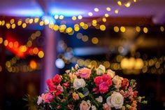 a vase filled with lots of pink and white flowers