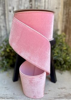 two pink lampshades stacked on top of each other