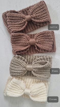 three crocheted headbands with bows on them