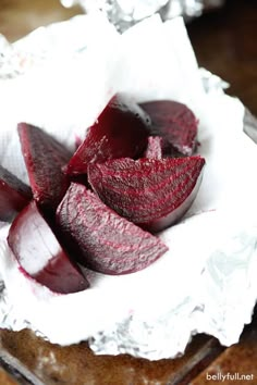 sliced beets sit in a bowl on a table