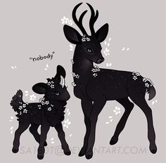 two black deer standing next to each other