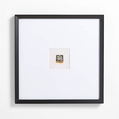 a black frame with a white wall behind it