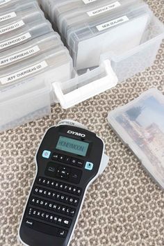 a calculator sitting on top of a table next to some plastic containers filled with data