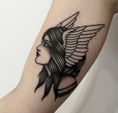 a woman's arm with an angel tattoo on the left side of her body