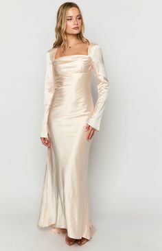 Satin Wrap Dress Long Sleeve White, Silk Dress Bridesmaid Long Sleeve, Luxury Long Sleeve Satin Finish Dress, Luxury Cream Satin Maxi Dress, Luxury Cream Dress With Sheer Sleeves, Luxury White Maxi Dress With Sheer Sleeves, Luxury Long Sleeve Cream Lace Dress, Luxury Long Sleeve Festive Maxi Dress, Longsleeve Neutral Bridesmaid Dresses