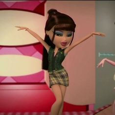 two animated dolls are standing in front of a wall and one is holding her arms out