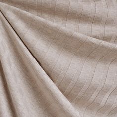 a close up view of a beige fabric