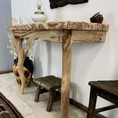 a wooden table and bench in a room