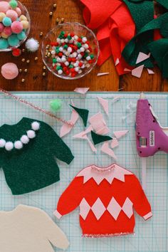 some crafting supplies are laid out on a cutting board and ready to be sewn