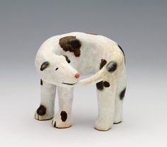 a white and black dalmatian dog figurine