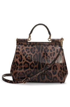 Signature Dolce&Gabbana panache and modern aesthetics merge on this leopard-print coated calf hair handbag from the Kim Kardashian runway collection. Magnetic-snap flap closure Top carry handle; removable, adjustable shoulder strap Interior zip and wall pockets Structured silhouette with flat base and protective metal feet Leather lining Genuine calf hair (China) Made in Italy Designer Handbags Top Handle Bags In Leopard Print, Designer Leather Bags In Leopard Print, Evening Bags With Leopard Print And Detachable Strap, Evening Bags With Detachable Strap In Leopard Print, Chic Tortoiseshell Leather Bag, Elegant Evening Bags In Tortoiseshell, Chic Double Handle Bag In Leopard Print, Leopard Print Top Handle Bag For Travel, Chic Tortoiseshell Bag For Everyday Use