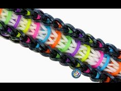 multicolored braiding bracelets with black beads on white background, close up