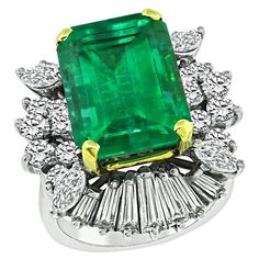 This is a stunning platinum ring. The ring is centered with a lovely emerald cut Colombian emerald that weighs approximately 8.00ct. The emerald is accentuated by sparkling baguette, marquise and round cut diamonds that weigh approximately 2.50ct. The color of these diamonds is G-H with VS clarity. The top of the ring measures 24.5mm by 21mm. The ring weighs 15.2 grams. The ring is size 6 1/2 but it can be resized. Inventory #51955BBSS 50 Carat Diamond Ring, African Inspired Jewelry, Colombian Emerald Ring, Emerald Rings, Colombian Emeralds, African Jewelry, Platinum Ring, Emerald Jewelry, Gem Stone