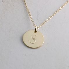 "Solid gold engraved initial necklace is a family heirloom that will be cherished and treasured for many years... it is the PERFECT gift! PICTURE IS ENLARGED TO SHOW DETAIL! SEE SECOND PICTURE FOR SIZE COMPARISON. PLEASE READ BELOW FOR ACTUAL MEASUREMENTS!! Your choice of one, two, or three solid gold 1/2\" (13mm) discs have been personalized just for you with a classy block font in a large 7mm size and it is GORGEOUS! (Font is shown in picture #6 above) The pendants hang from a solid 14k gold 1 Classic Engraved Rose Gold Charm Necklaces, Classic Rose Gold Engraved Charm Necklaces, Classic Engraved Rose Gold Initial Necklace, Formal 14k Gold Engraved Initial Necklace, Fine Jewelry Engraved Charm Necklace With Round Pendant, Fine Jewelry Charm Necklace With Engraved Round Pendant, Elegant 14k Gold Monogram Charm Necklace, Fine Jewelry Engraved Round Pendant Charm Necklace, Engraved Round Pendant Charm Necklace In Fine Jewelry Style