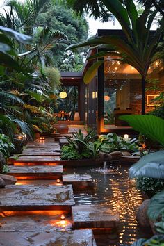 an outdoor garden with lights and water features