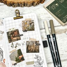 the contents of a planner spread out on a white wooden table with pens and pencils