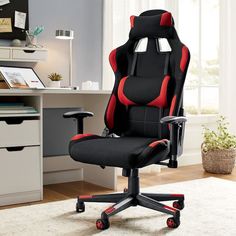 a black and red office chair sitting on top of a white rug in front of a desk