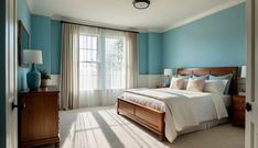 a bed sitting in a bedroom next to a window with curtains on the windowsill