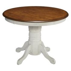 a white and wood table with four legs