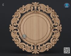 a wooden plate with an ornate design on the front and side, sitting on a black surface