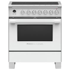 a white stove top oven sitting on top of a metal countertop with two burners