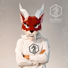 a man in a white hoodie with an origami fox mask on